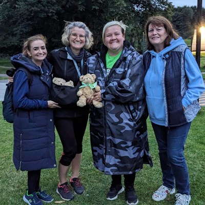 Four people who attended the Walk Together event in Heaton Park, Manchester with their Aching Arms Bears